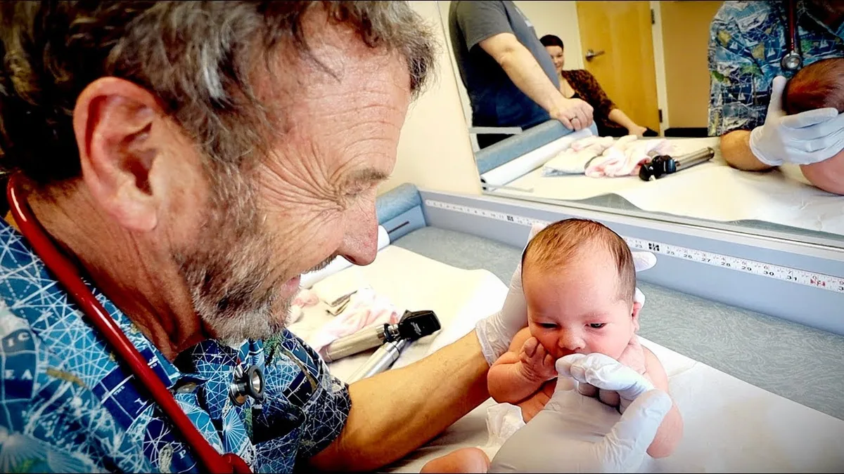 pediatrician examining baby boy