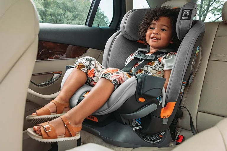 when can a baby front face in a car seat